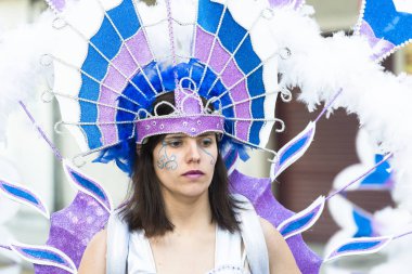 PONTEVEDRA, SPAIN - FEBRUARY 20, 2016: People dressed during the parade held in the city for the Winter Carnival.