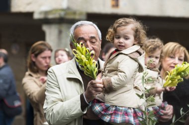PONTEVEDRA, SPAIN - MARCH 29, 2015: Detail of person participating in the celebration of Palm Sunday before Easter.