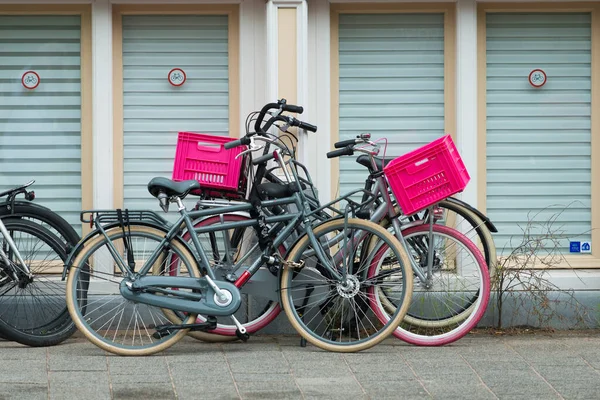 Amsterdam Netherlands July 2015 Bicycles Parked Pink Containers Some Signs — Stock Photo, Image