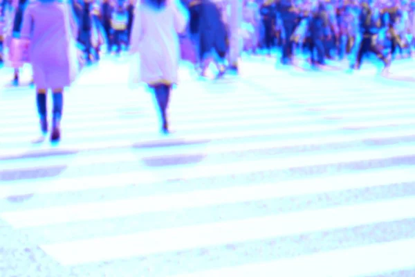 Abstract blurred image holographic foil style of people walking