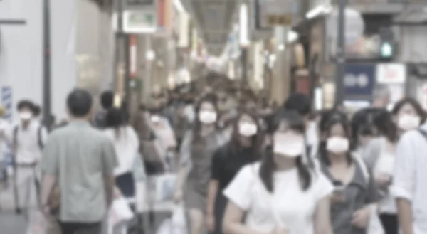 Abstract blur asian people walking