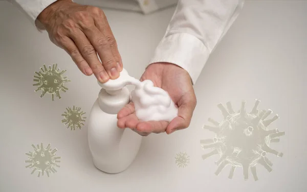 Hand sanitizer soap foam clean hands hygiene prevention of corona virus outbreak. Man using bottle of antibacterial sanitiser soap. 3D rendering of Coronavirus model  covid-19