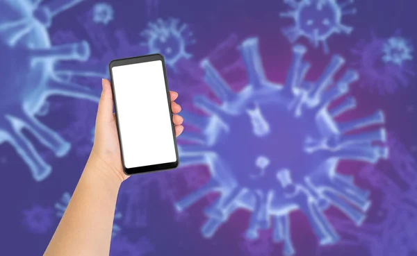 Hand holding blank white screen mobile phone with blurred image of Coronavirus background. medical concept