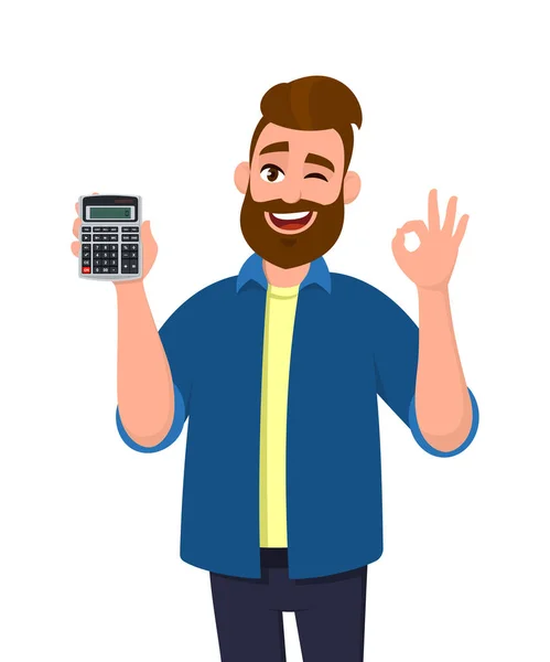 Młody człowiek pokazując lub trzymając cyfrowy kalkulator urządzenie w dłoni i gestykulując, co w porządku lub Ok znak podczas mrugania okiem. Dobry, pozytywny, nowoczesny styl życia, technologia, biznes i finanse, bankowość. — Wektor stockowy