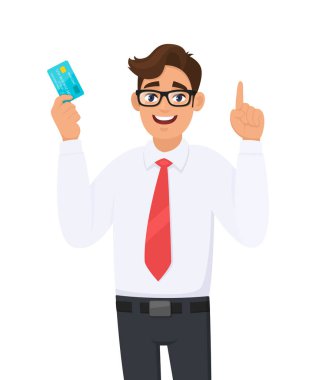 Kredi kartı (ATM) tutan ya da gösteren genç işadamı ve el parmağıyla işaret işareti yapan ya da işaret eden. Erkek karakter tasarımı çizimi. Vektör karikatüründe modern yaşam tarzı kavramı.