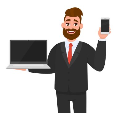 Genç iş adamı elinde yeni bir marka, boş ekran dizüstü bilgisayar (PC) ve cep telefonu, akıllı telefon tutuyor ya da gösteriyor. Modern yaşam tarzı, dijital teknoloji aygıtı, aygıt, çizgi filmdeki mobil uygulama.