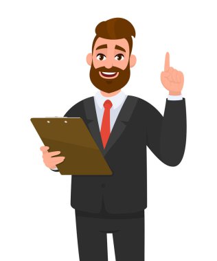 Takım elbiseli genç bir iş adamı pano tutuyor ve işaret parmağıyla işaret ediyor. Dosya defterini elinde tutan kişi. Erkek karakter tasarımı çizimi. Vektör karikatüründe modern yaşam tarzı kavramı.