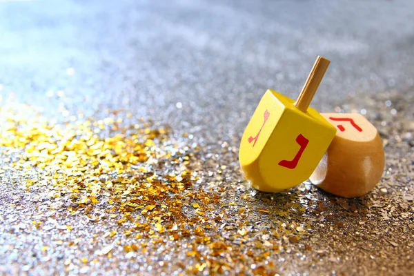 Jewish holiday Hanukkah with wooden dreidel (spinning top) — Stock Photo, Image