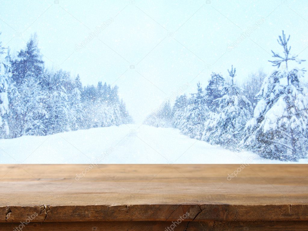 Empty table in front of dreamy winter landscape