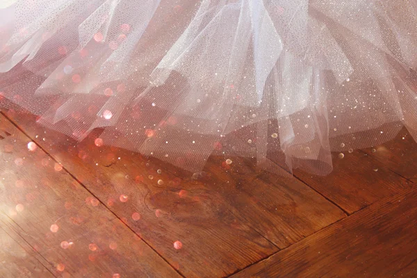 White ballet tutu on wooden floor — Stock Photo, Image