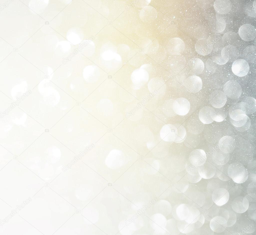 glitter vintage lights background. silver and white