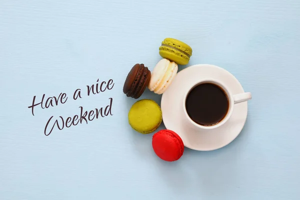 Top view of cup of coffee with colorful macaron — Stock Photo, Image