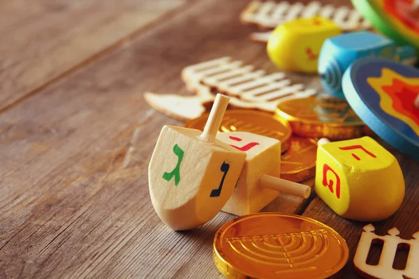 jewish holiday Hanukkah with wooden dreidels colection