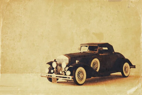 Vintage toy car over wooden table — Stock Photo, Image