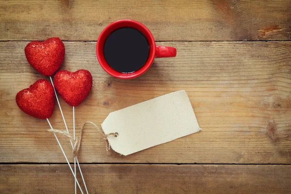 Red hearts and cup of coffee — Stock Photo, Image