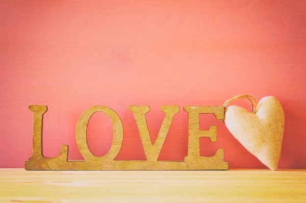 Word LOVE from wooden letters and heart — Stock Photo, Image