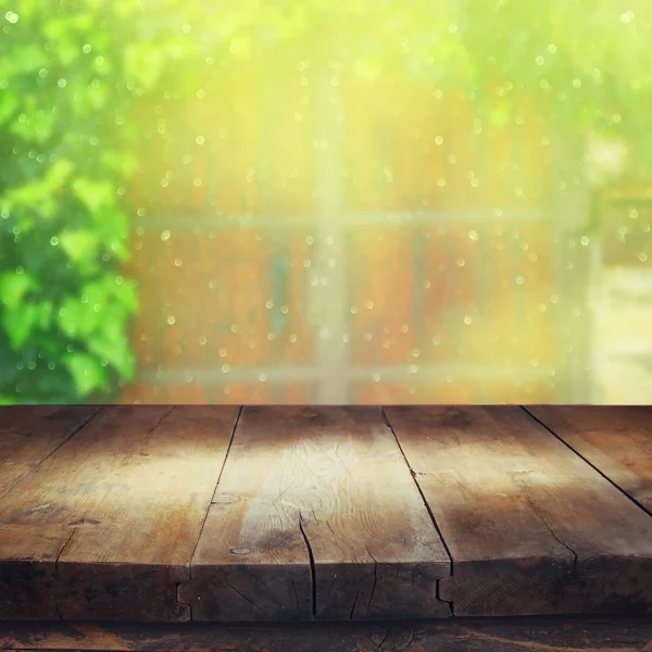 Wooden table with waterdrops on glass — Stock Photo, Image