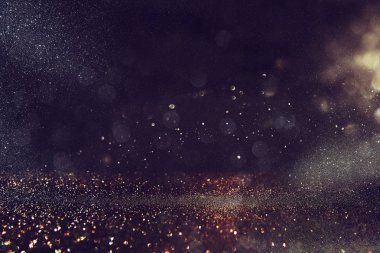 Glitter vintage ışıklar arka plan. altın siyah