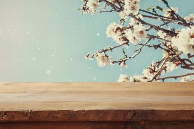 wooden table in front of spring cherry tree clipart