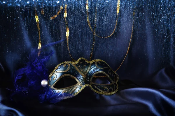 Elegant venetian mask on blue silk background — Stock Photo, Image