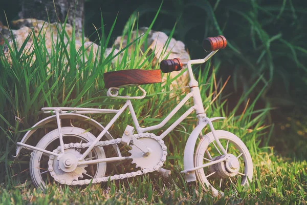 Vintage bicycle miniature toy waiting outdoors — Stock Photo, Image