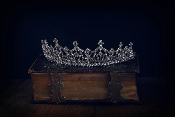 Diamond queen crown on old book — Stock Photo, Image