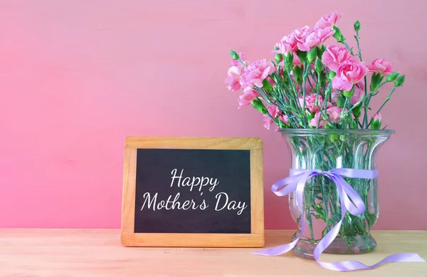 Mothers day concept. Bouquet of Carnation flowers in the vase — Stock Photo, Image