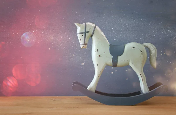 vintage rocking horse on wooden floor