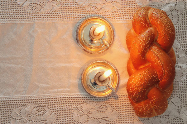 shabbat image. challah bread, shabbat wine and candles