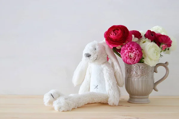 rosses in the vintage vase and funny fluffy bunny