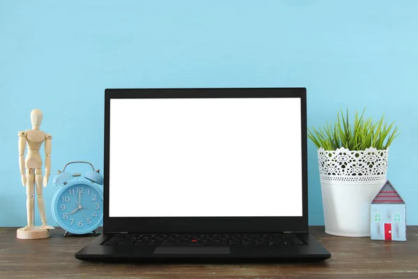 Office work place with open leptop and empty white screen for copy space — Stock Photo, Image