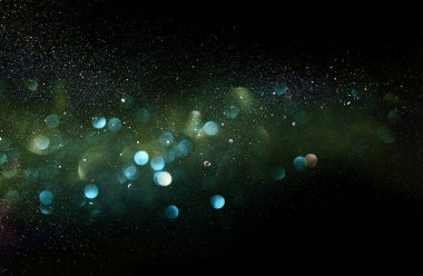 Glitter vintage ışıklar arka plan. yeşil, mavi ve siyah. de-odaklı.