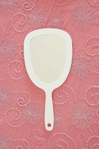 Top view image of vintage hand mirror on lace background — Stock Photo, Image