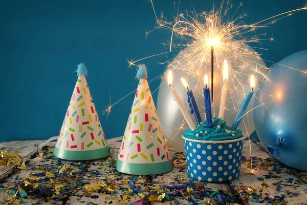 Birthday concept with cupcake and candles on wooden table — Stock Photo, Image