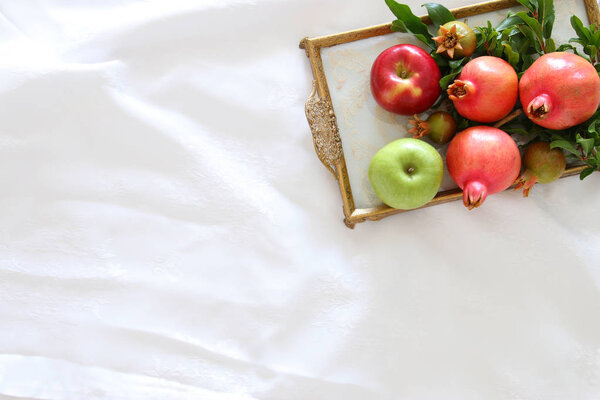 Rosh hashanah (jewesh New Year holiday) concept - pomegranate. Traditional symbol