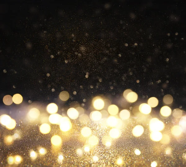 Glitter vintage ışıklar arka plan. siyah ve altın. de-odaklı — Stok fotoğraf