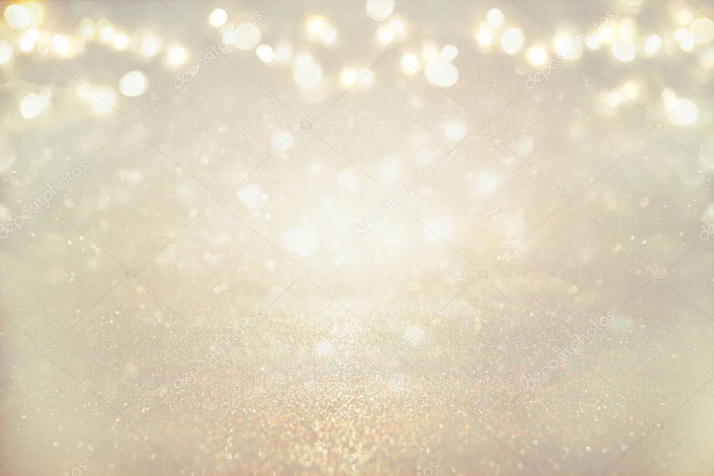 glitter vintage lights background. silver and light gold. de-focused