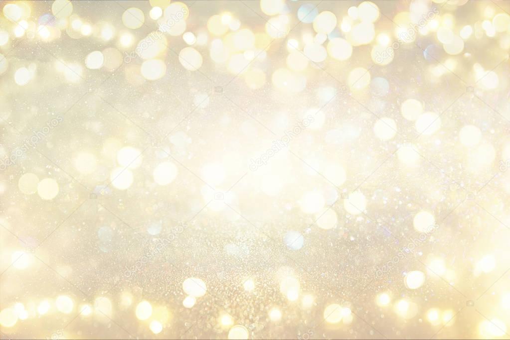 glitter vintage lights background. silver and light gold. de-focused