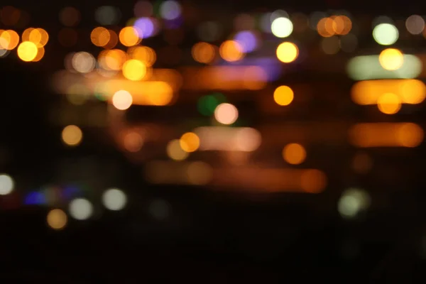 Imagen de colorido desenfocado desenfocado bokeh luces. concepto de movimiento y vida nocturna —  Fotos de Stock