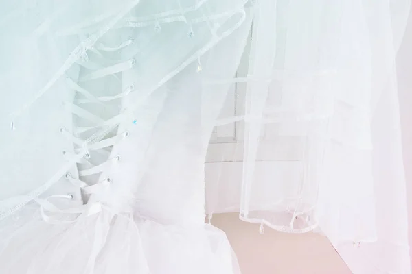 Beautiful white wedding dress and veil on chair — Stock Photo, Image