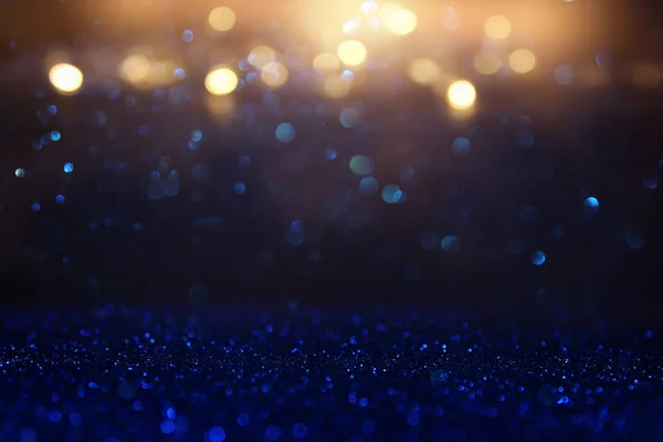 Glitter vintage lights background. blue, gold and black. de focused — Stock Photo, Image