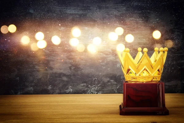 Image of golden crown award over wooden table — Stock Photo, Image