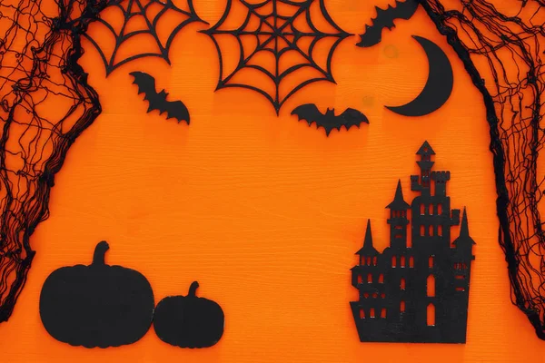 Halloween vakantie concept bovenaanzicht scène over houten oranje achtergrond — Stockfoto