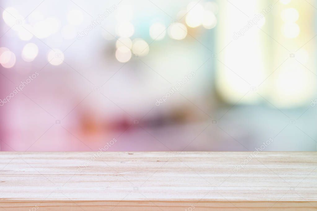 empty table board and defocused bokeh lights background. product display and picnic concept