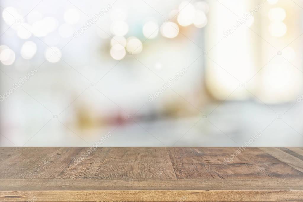 empty table board and defocused bokeh lights background. product display and picnic concept