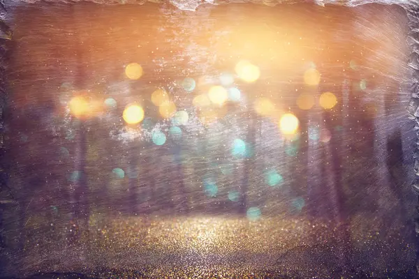 Abstract photo of light burst among trees and glitter bokeh lights. image is blurred and filtered — Stock Photo, Image