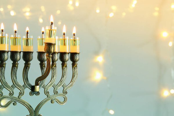 Image of jewish holiday Hanukkah background with menorah (traditional candelabra)