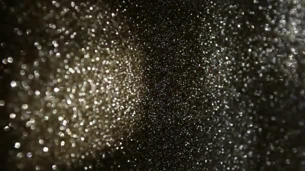 Filmati di riflessi di luci glitter oro, nero e argento . — Video Stock