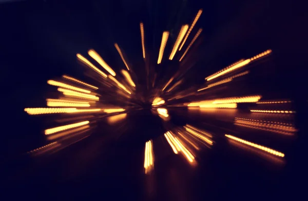 Abstracte bokeh achtergrond van gouden licht burst gemaakt van bokeh beweging — Stockfoto