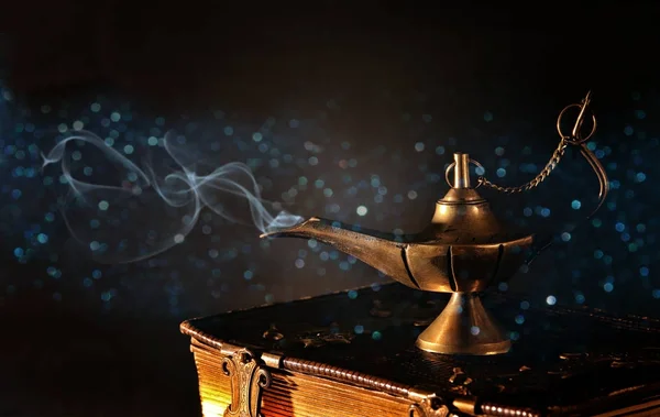 Image of magical aladdin lamp with gold glitter smoke. Lamp of wishes — Stock Photo, Image